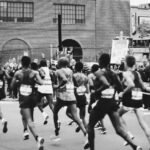grayscale photo of men running on marathon